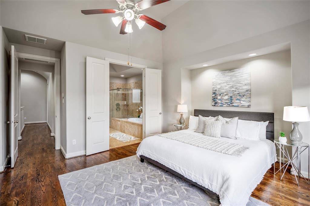 Primary bedroom is spacious enough for a king-sized bed (pictured here) and other large furniture pieces.