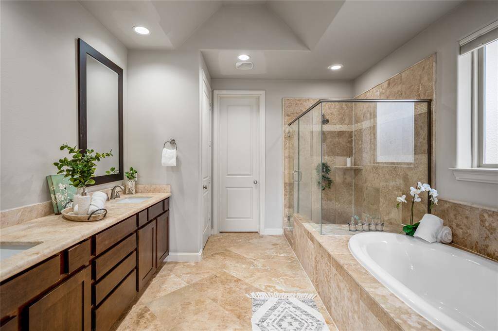 This is your primary bath with a separate soaking tub and stand-up shower.