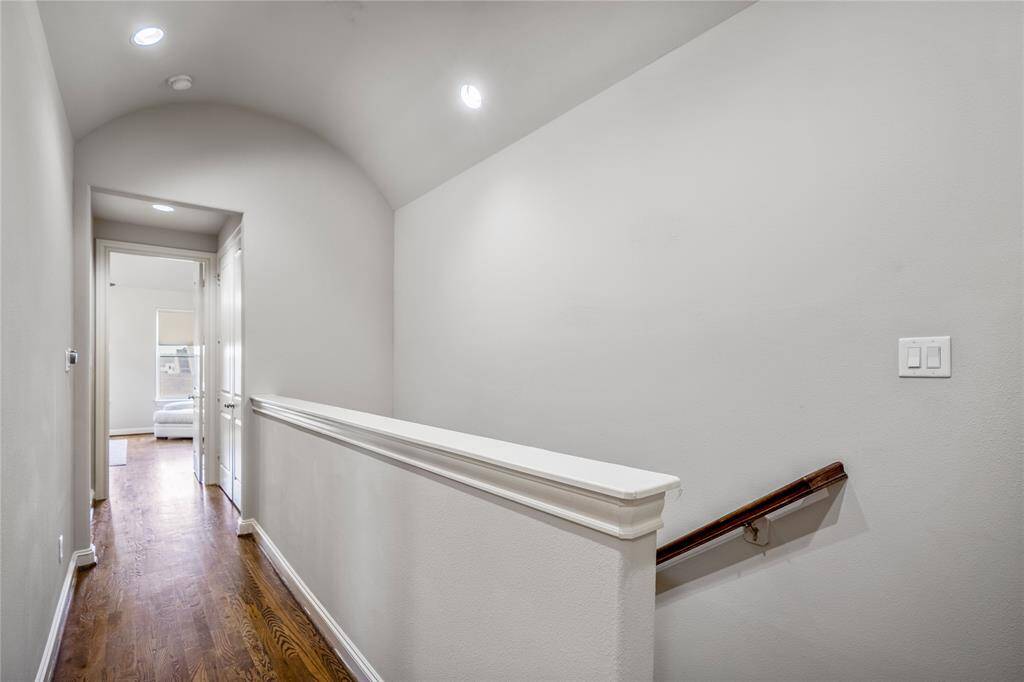 Down the hallway is the utility room and to another bedroom.
