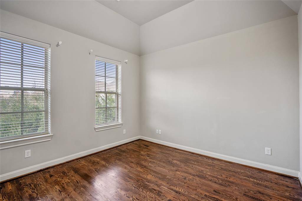 Another look at this secondary bedroom with two windows overlooking the front of the home.