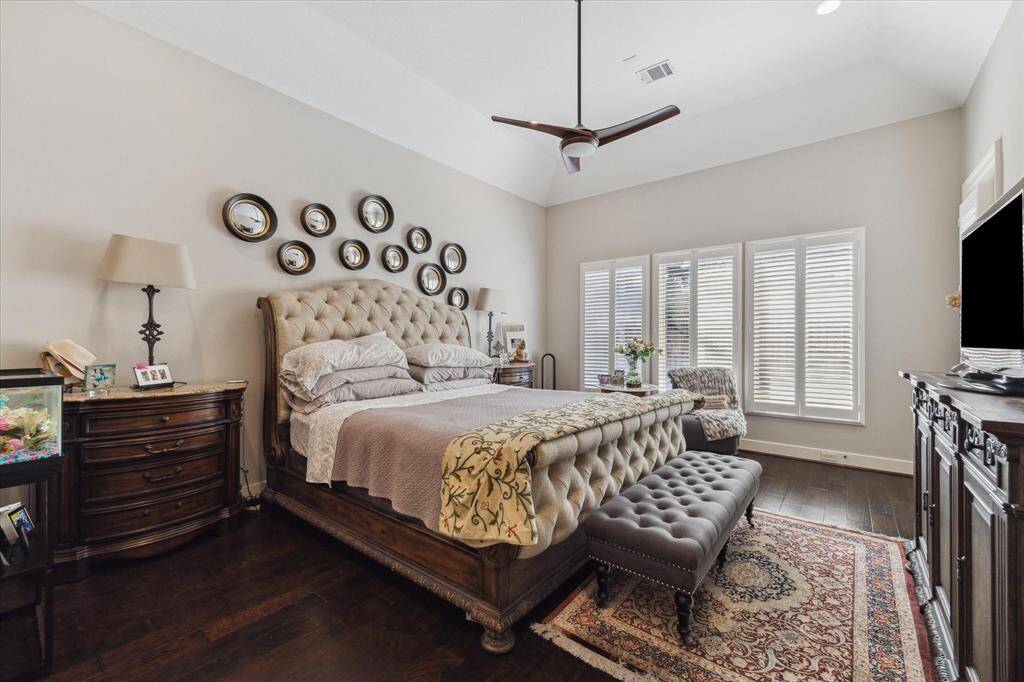 ELEGANT PRIVATE PRIMARY BEDROOM SUITE ON 1ST FLOOR - handsome wood flooring, plantation shutters, vaulted raised ceiling, private access to covered terrace