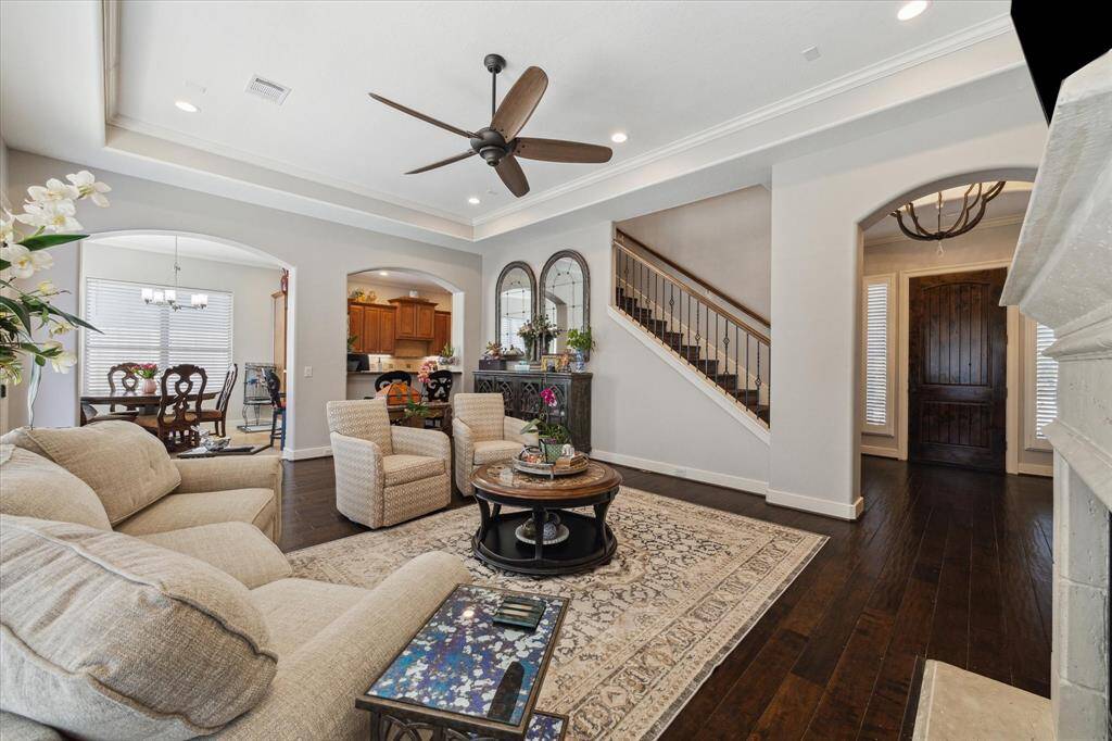 VIEW OF FAMILY ROOM TOWARD FOYER, BREAKFAST ROOM AND KITCHEN