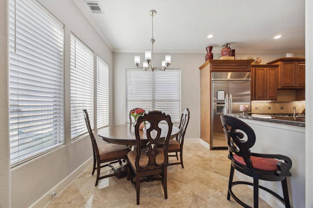 BREAKFAST ROOM FOR CASUAL DINING ANY TIME OF DAY - beautiful travertine flooring, decorative chandelier