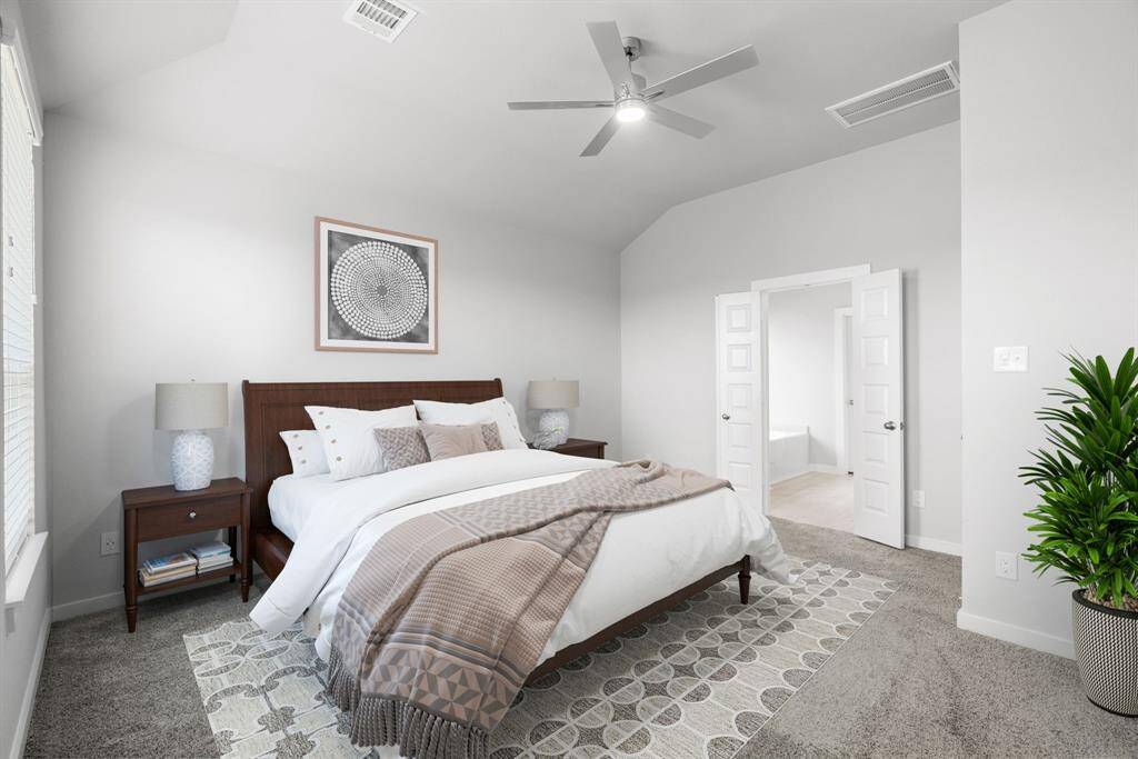 Escape and relax in the exquisite primary suite, a haven to unwind after a long day. The spacious room, located on first floor, boasts plush carpeting, soothing paint tones, high ceilings, and expansive windows adorned with privacy blinds. Virtual Staged.