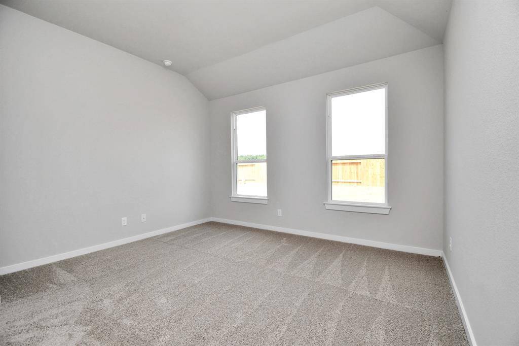 Discover another perspective of the spacious primary suite. Sample photo of completed home with similar floor plan. Actual colors and selections may vary.