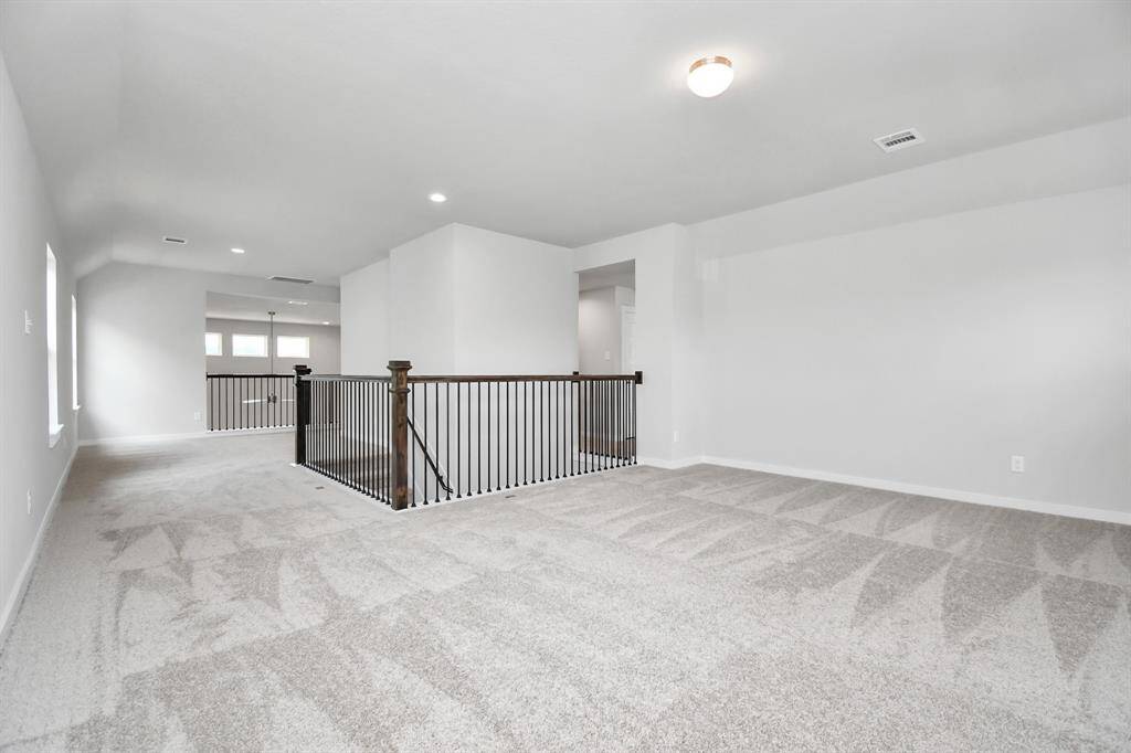 Another view of the upstairs game room. Sample photo of completed home with similar floor plan. Actual colors and selections may vary.