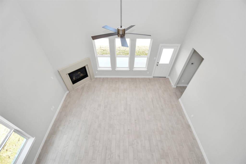 View of high ceilings from above. Sample photo of completed home with similar floor plan. Actual colors and selections may vary.