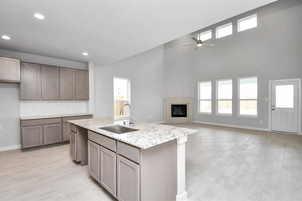 Step into a dream realized with this generously spacious kitchen! Sample photo of completed home with similar floor plan. Actual colors and selections may vary.