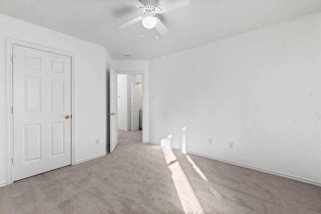 The two secondary bedrooms feature new carpet with freshly painted walls,  offering a clean and neutral space ready for personalization.