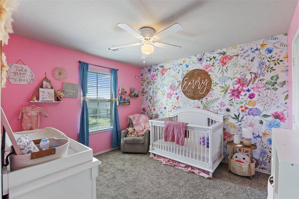 Precious girls room. Wall paper can be taken down easily