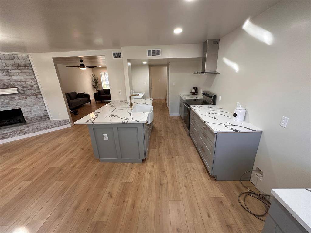 Kitchen area was raised for a more spacious look