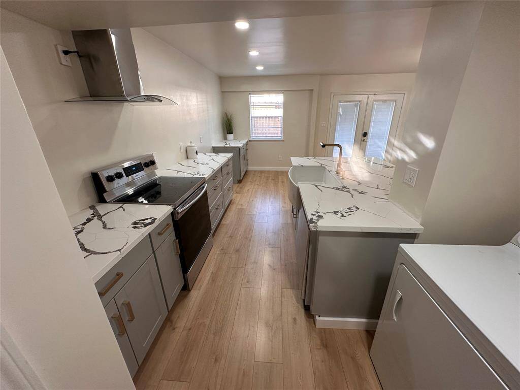Kitchen area was raised for a more spacious look