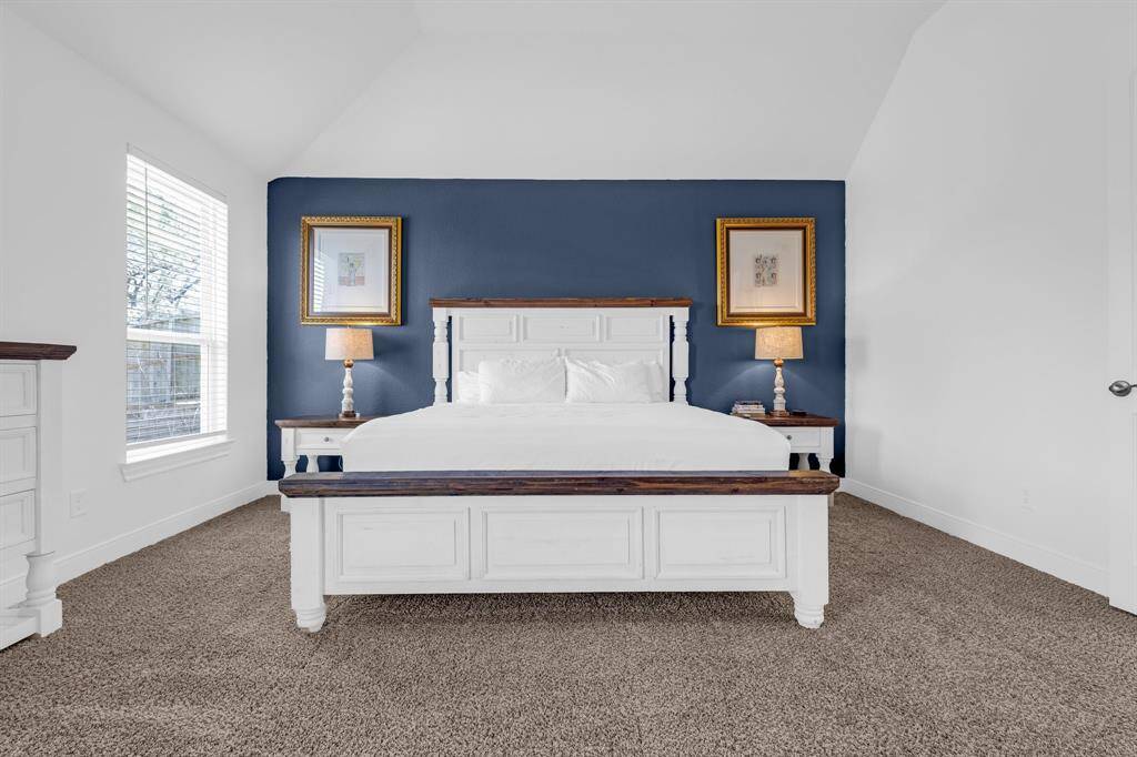 Whether you're looking to unwind after a long day or enjoy a quiet morning with a book, this primary bedroom offers the perfect blend of charm and versatility, making it a standout feature of this home.