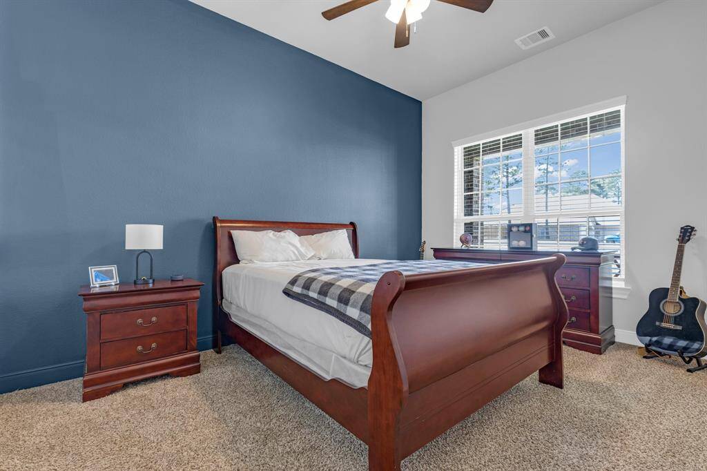This secondary bedroom is a perfect blend of style and functionality, adding value and comfort to your home.