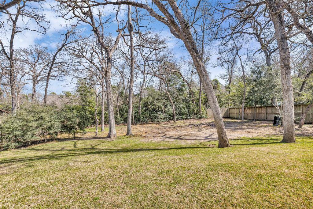Experience the natural beauty of this 0.54-acre lot, where mature trees create a serene oasis.