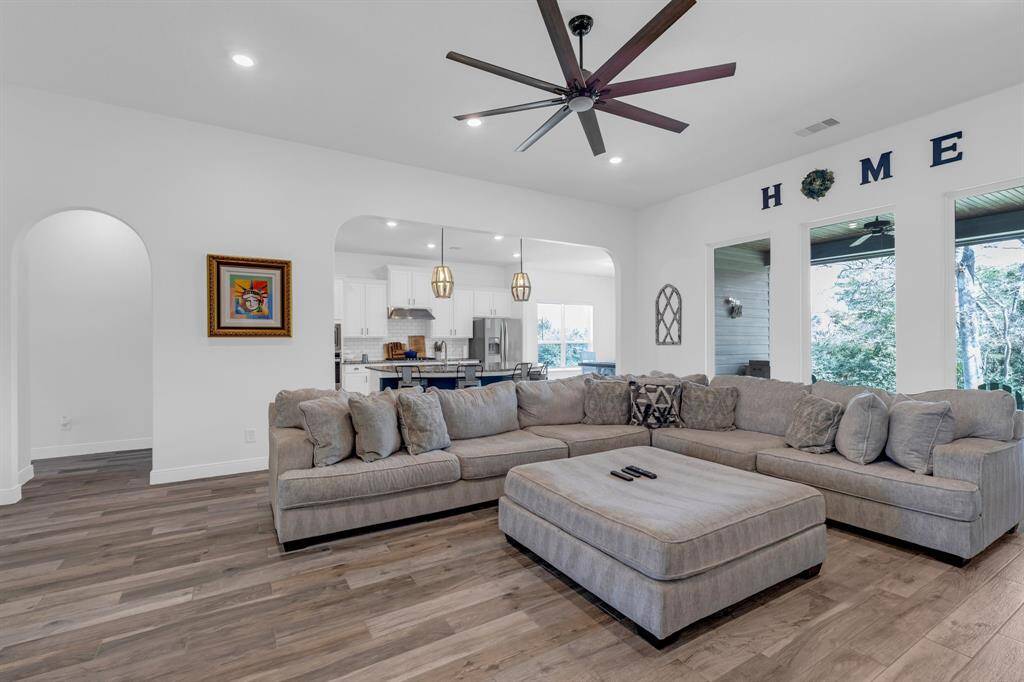 As you enter, you're greeted by a grand foyer featuring high ceilings and elegant flooring that sets the tone for the rest of the home.