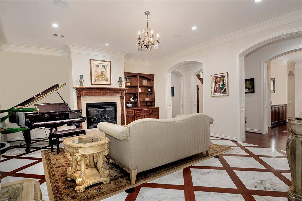 Another view of the formal living with stunning floors and built-ins