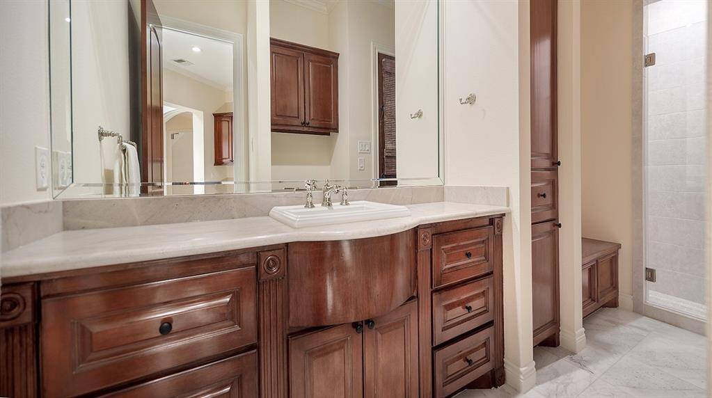 This full pool bath opens to the patio, and is also conveniently located by the garage