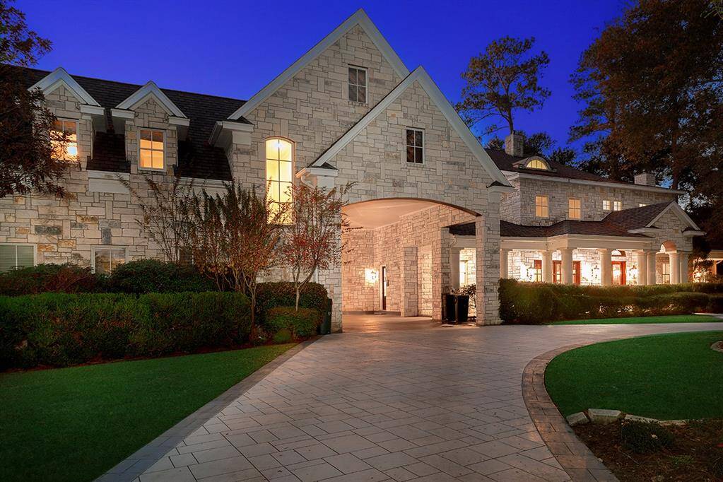 The gated entry, convenient porte-cochere and covered front porch welcome you inside