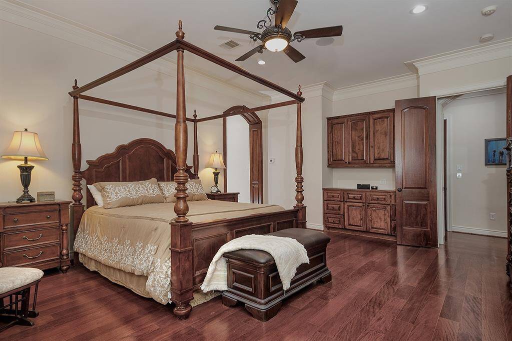 The owner's retreat has beautiful built-ins and a door leading to the screened-in patio