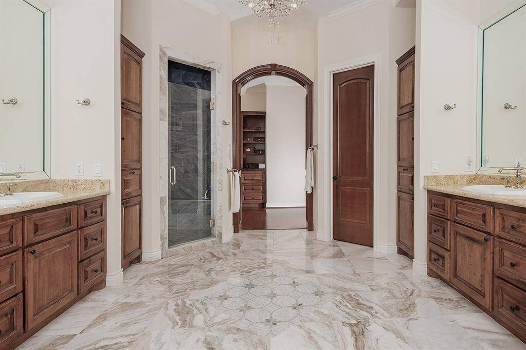 Large shower and an enormous walk-in closet with built-ins