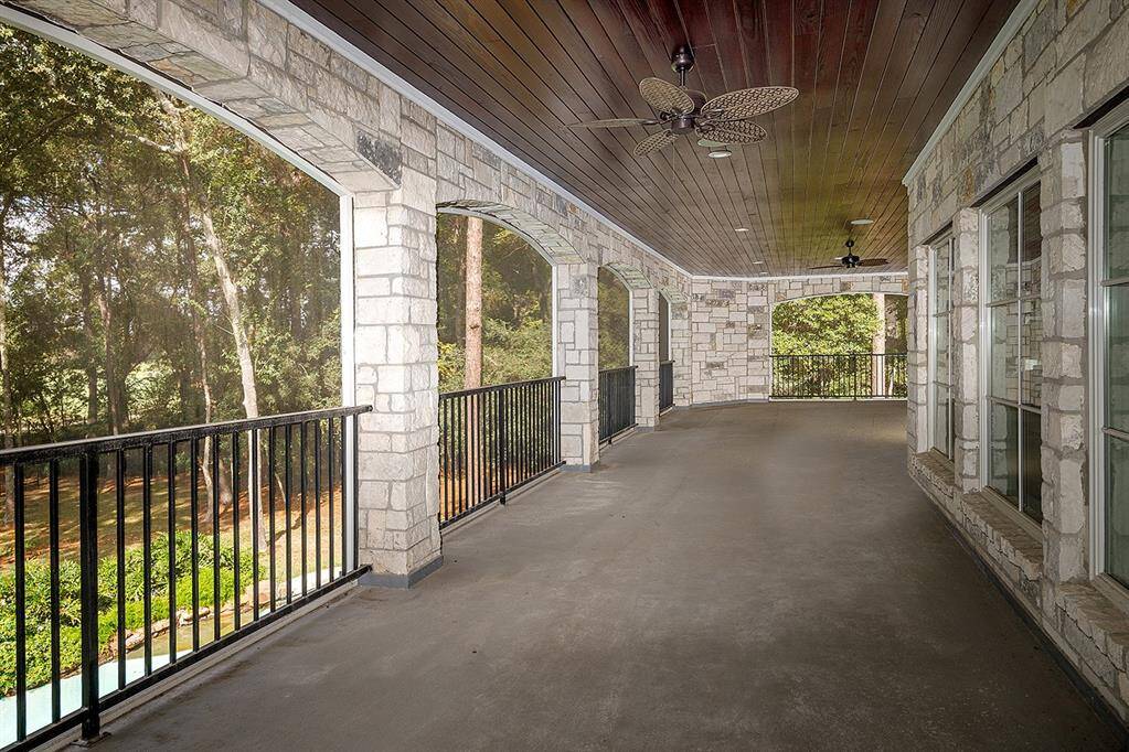 This enormous balcony overlooks the backyard and golf course