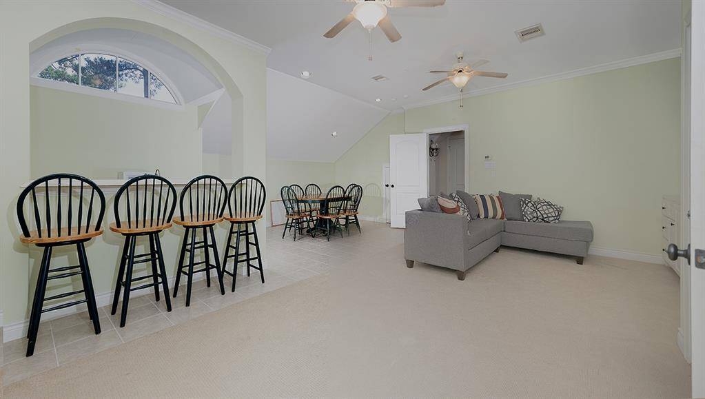 3rd floor living area with kitchenette has an additional two bedrooms and media room