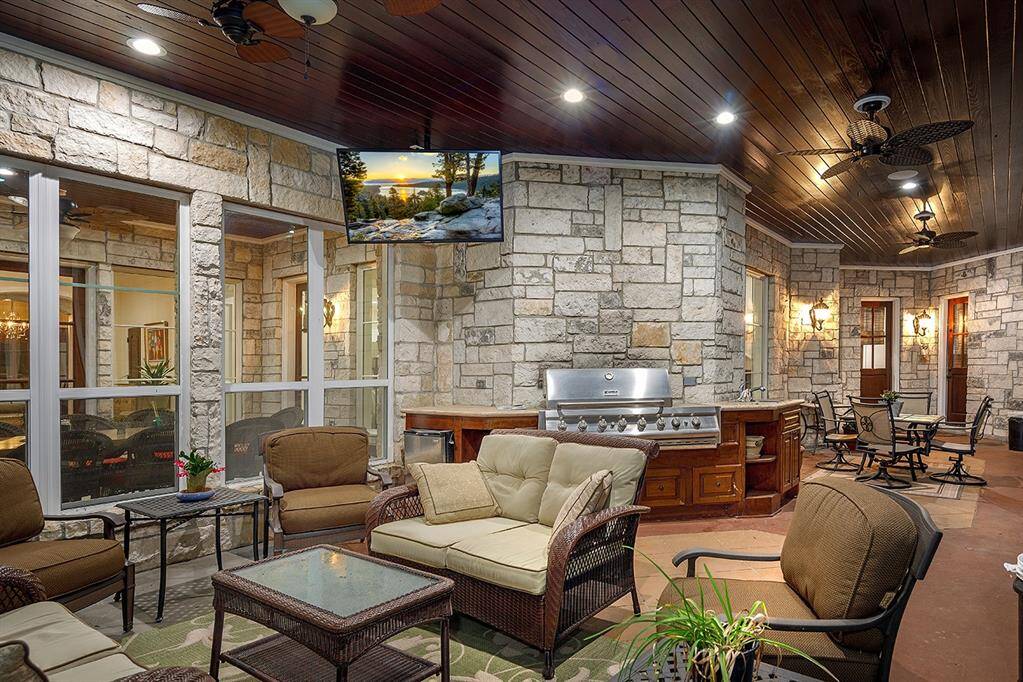 The outdoor kitchen in the screened in patio is ideal for entertaining