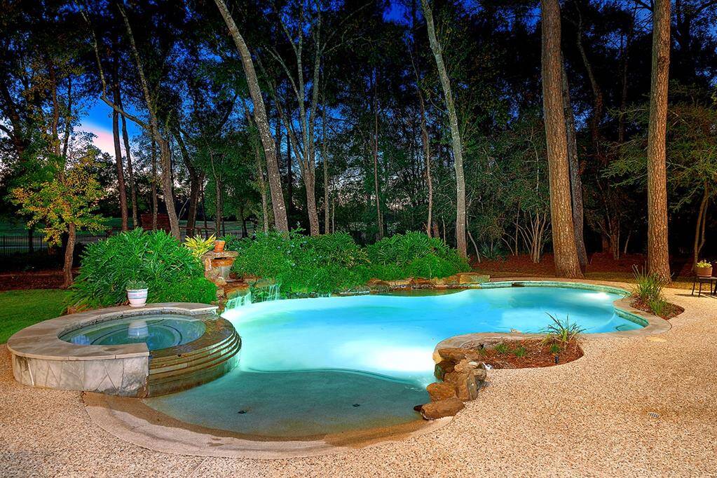 Beach entry pool with waterfalls on an impressive 1.47 acre lot