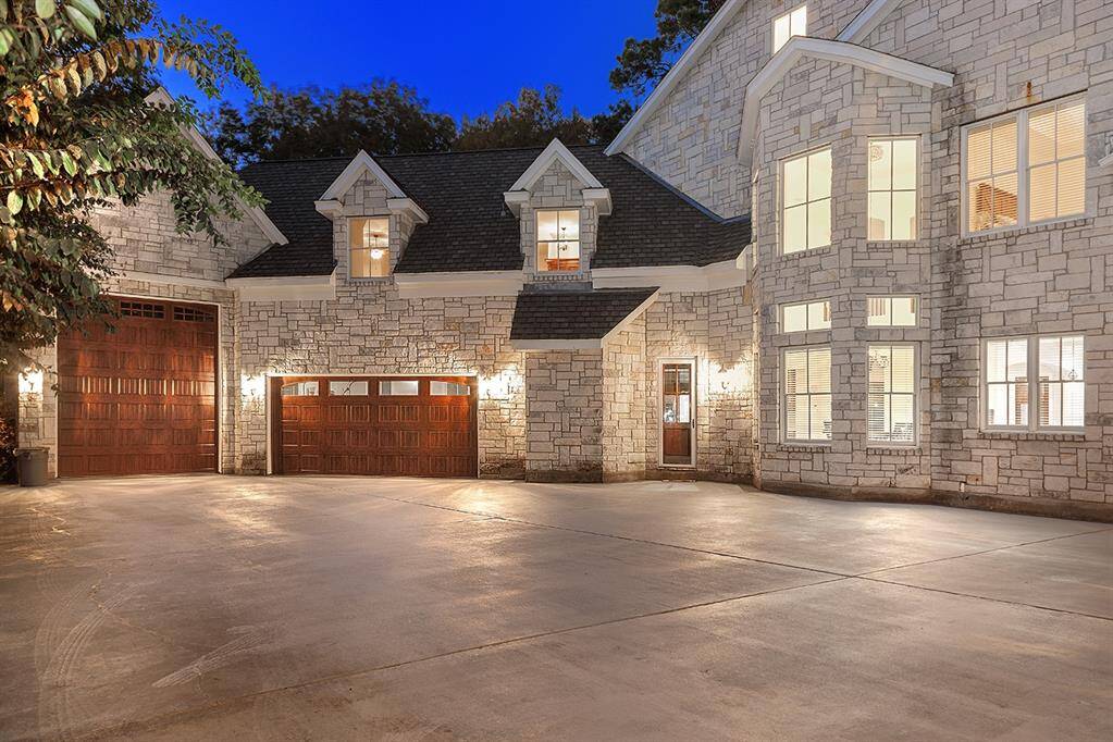 Parking will never be a problem here, with a five car garage - one can house a full size RV, and porte-cochere
