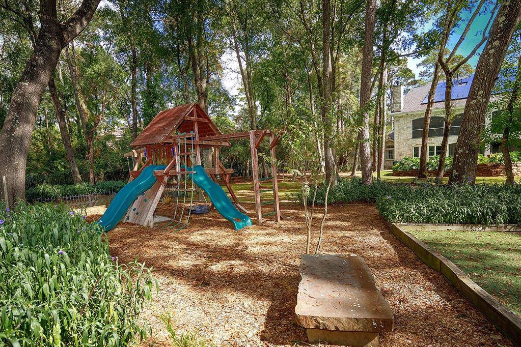 View of the park-like backyard surrounded by mature shade trees