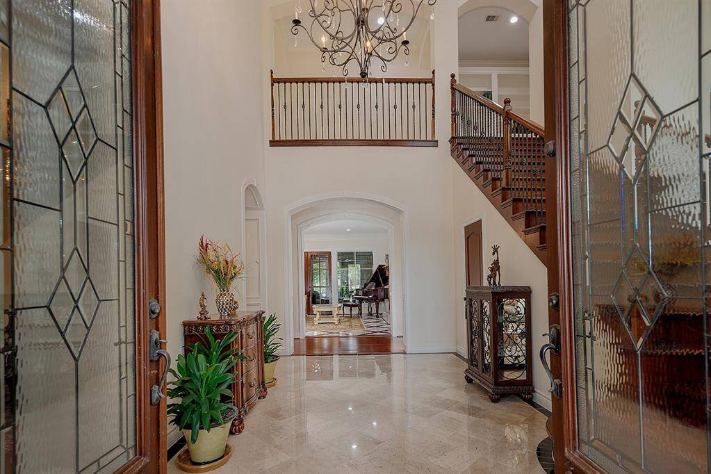 View from the entry, there's a guest bath and private study to the right and a formal living area straight ahead