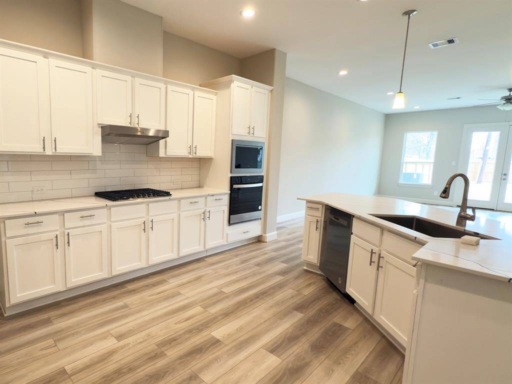 Oversized countertops, phenomenal lighting andExceptional storage space and lots of room for cooking and entertainment. Images depicts home as-is.