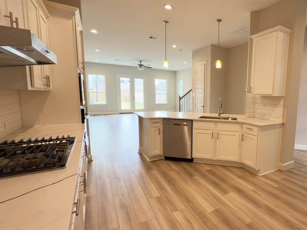 Oversized countertops, phenomenal lighting and open concept design. Images depict similar products at other ROC Homes properties. Image depicts home as-is.