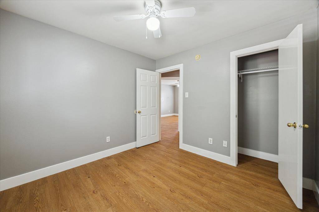 Your family or guests will rest comfortably in this roomy bedroom with wood laminate flooring, neutral paint, a large closet and easy access to a full bathroom.