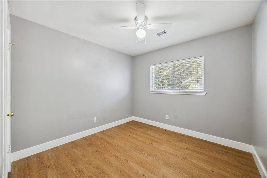 An alternate view of this guest bedroom shows ample space for large furnishings, games, toys and all of your personal touches.