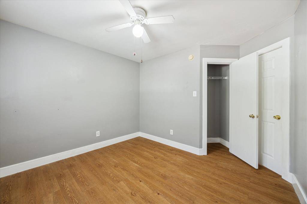 All three bedrooms feature durable and beautiful wood-laminate flooring, neutral paint, large walk-in closets, lit ceiling fans, and easy access to the full bathroom.