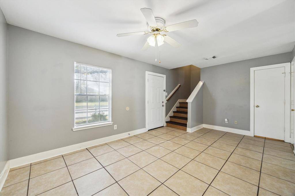 The family room has ample space for large cushy furnishings so everyone can gather here and relax comfortably.