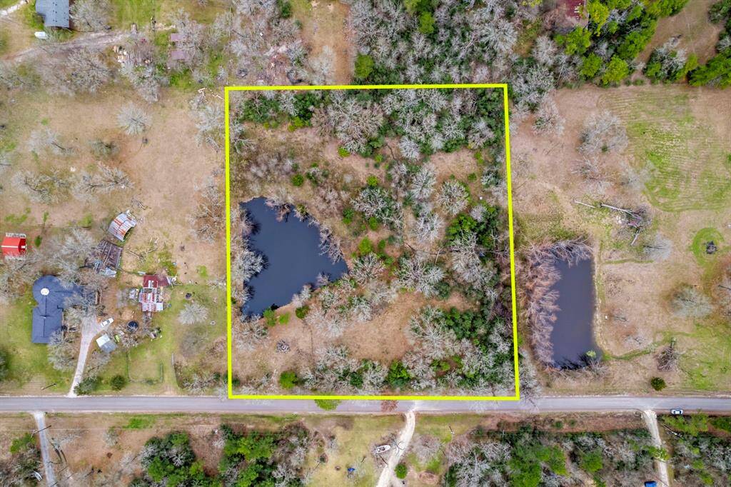 Mature trees dot the landscape and the well-stocked pond is a delight for recreational fishing!