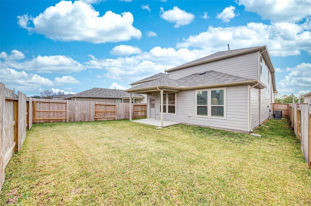 Large fully fenced backyard.