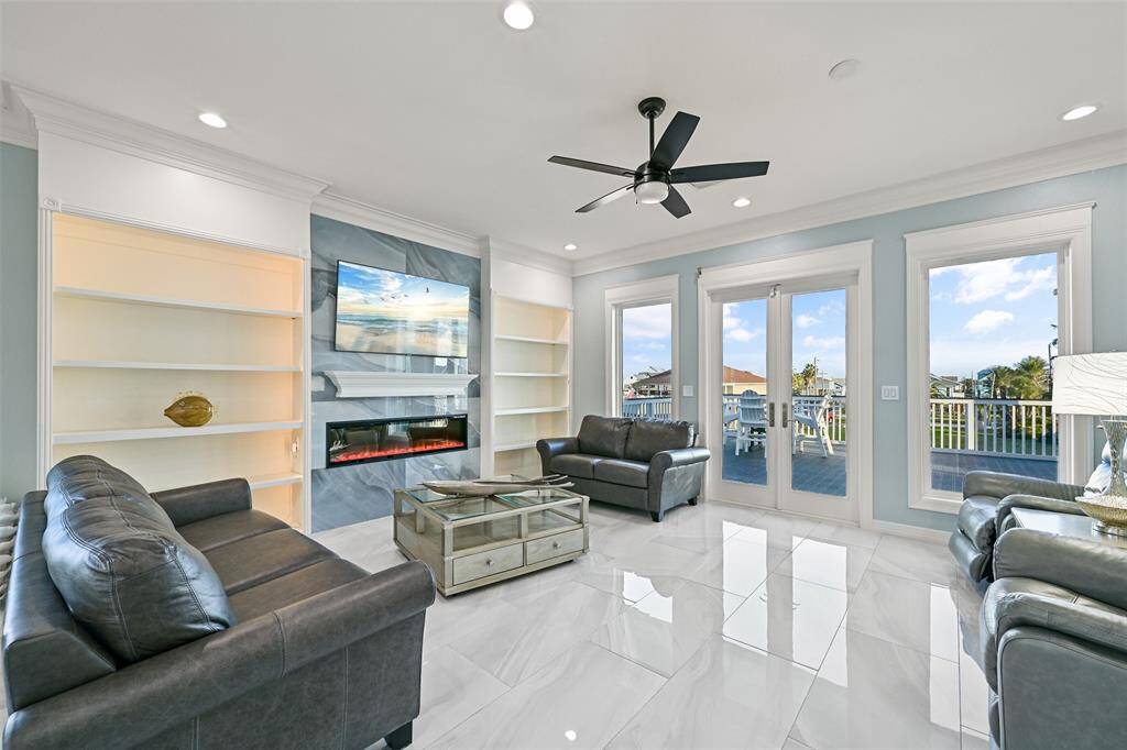 Large living room with electric fireplace for those cool island nights