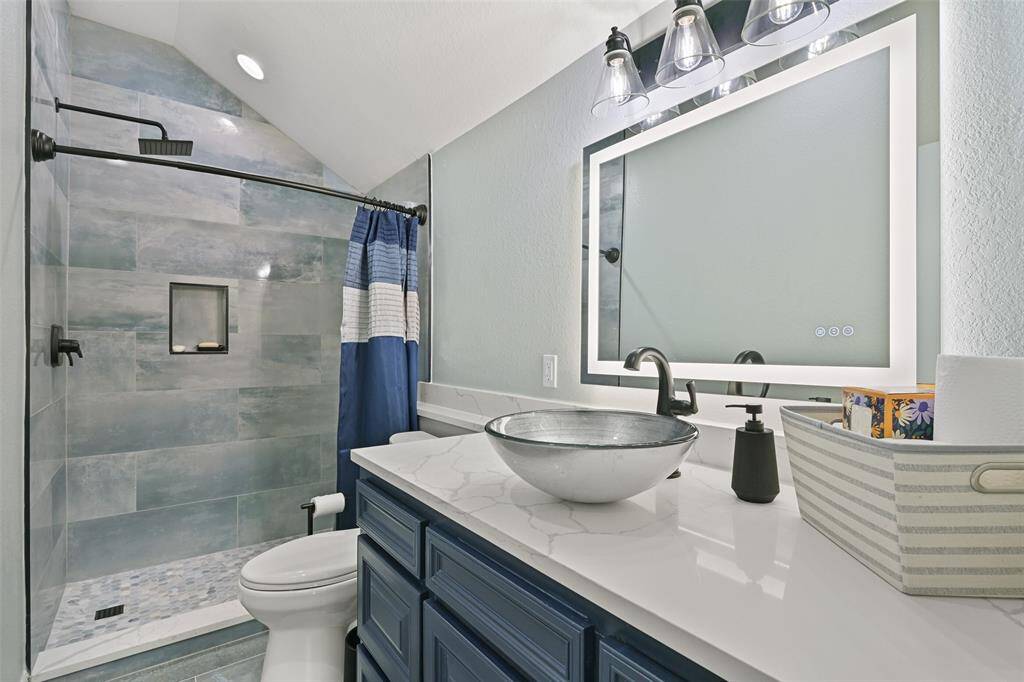 Guest bathroom  also with backlit mirror