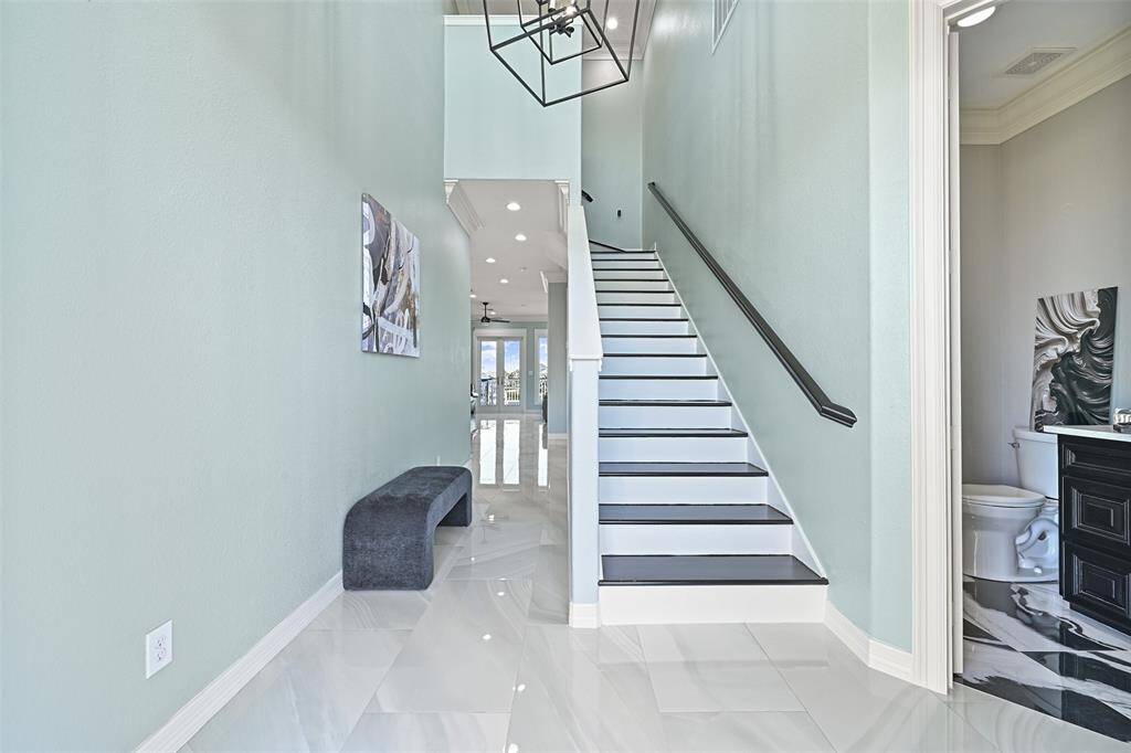 Entryway looking towards the living area with half bath on your right