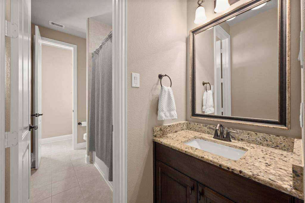 Jack and Jill bathroom sharing the two bedrooms just off of the entrance to the home.