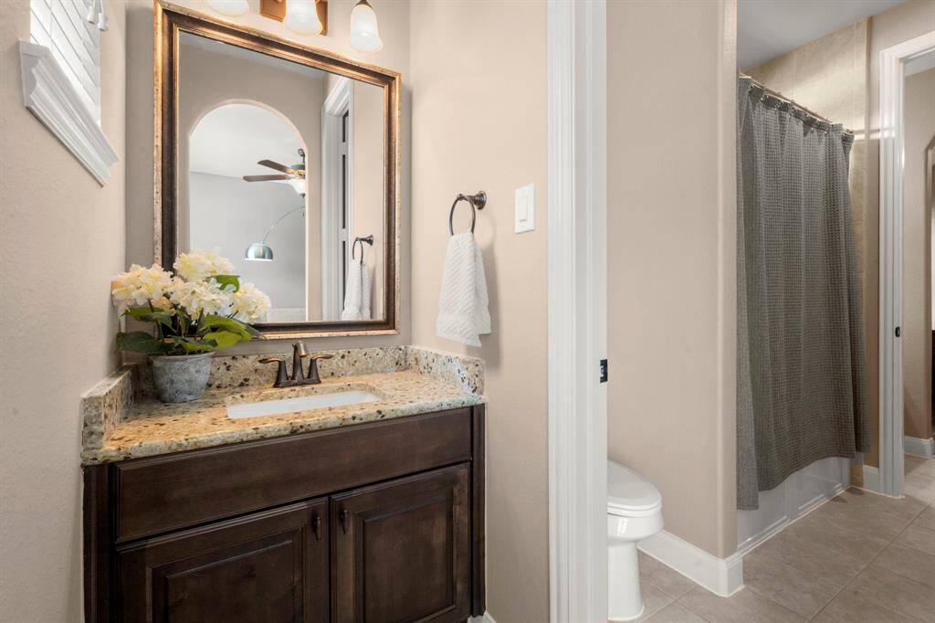 Jack and Jill bathroom sharing the two bedrooms just off of the entrance to the home.