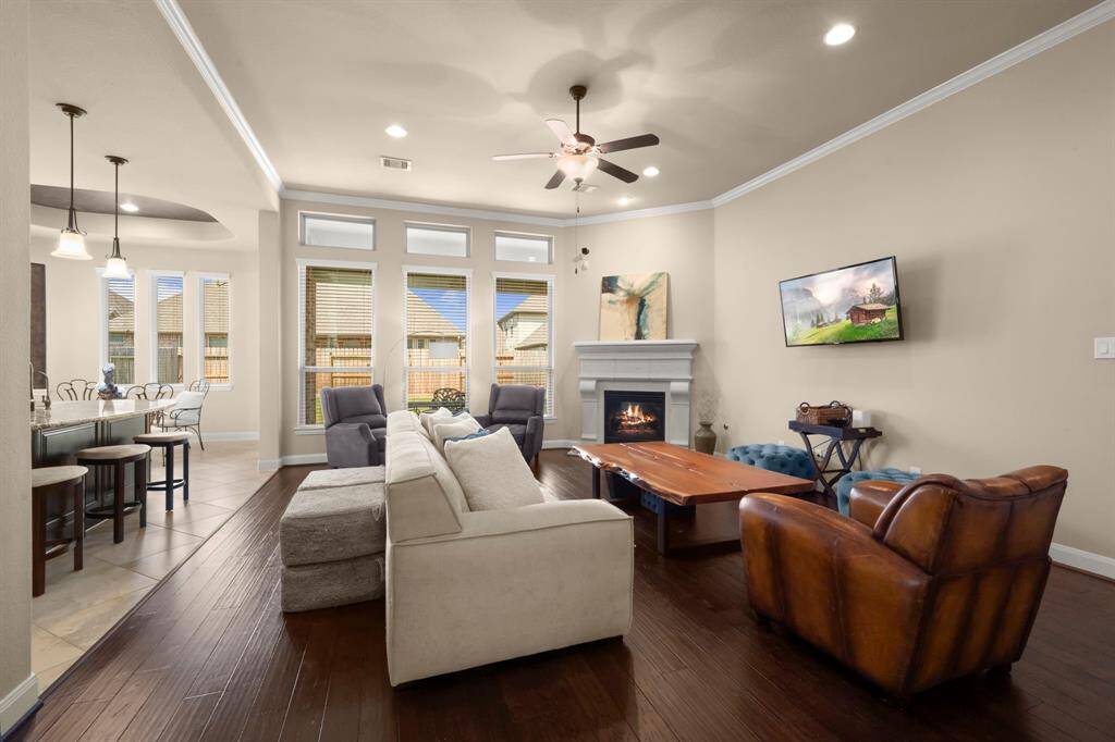 Rich hardwood floors add warmth and sophistication to the heart of the home.
