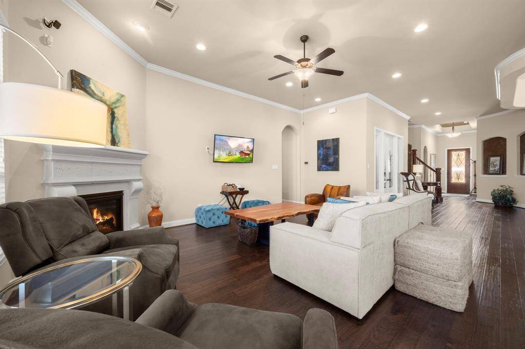 Features a stunning gas log fireplace, perfect for warmth and ambiance.