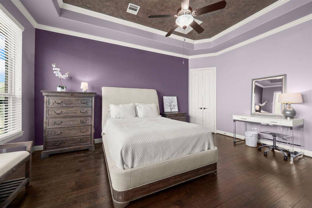 Step into your own private oasis in this stunning primary suite, designed for both comfort and sophistication. The tray ceiling adds an elegant architectural touch, enhancing the sense of space and luxury.