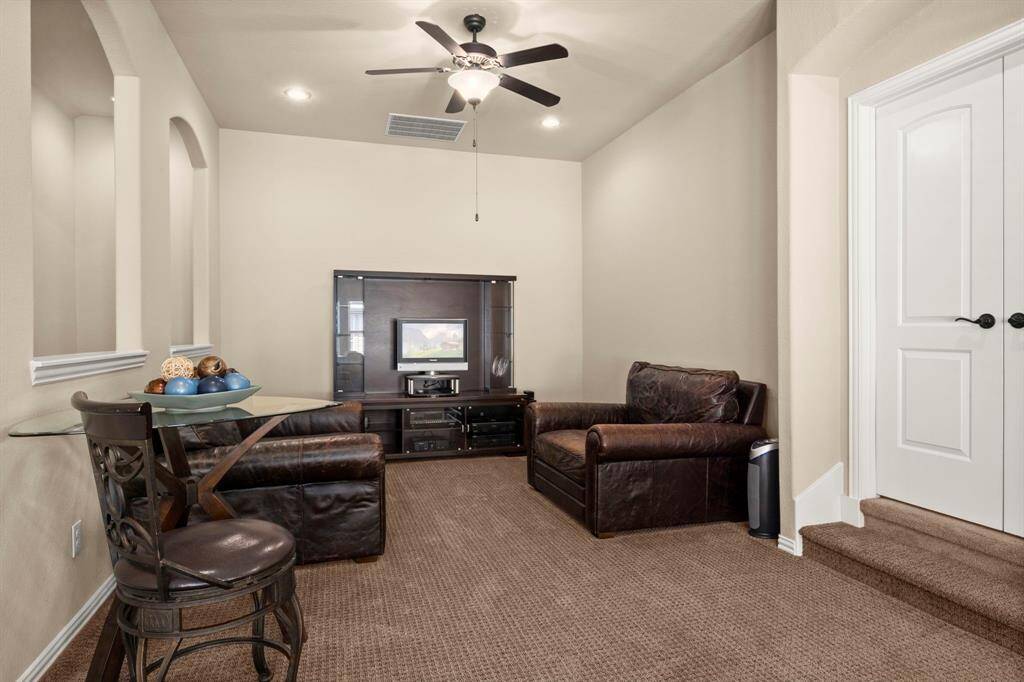 Large and versatile game room, perfect for a pool table, play area, or additional lounge space.