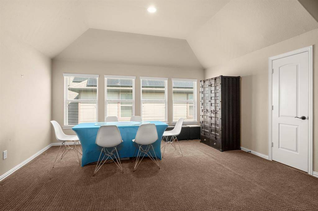 Windows provide natural light while maintaining a cozy feel. Spacious enough to host game nights, movie marathons, or casual hangouts.